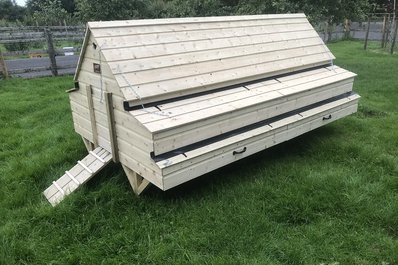 Manor Coop — our largest poultry house for 40–50 hens, garden setting.